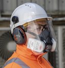 Hard-hat mounted cough guard will help protect site workers Hard-hat mounted cough guard will help protect site workers